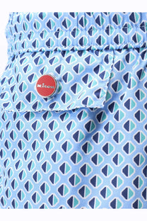 Kiton men’s nylon swim trunks in light blue with navy teal triangle pattern and red kiko brand button accent