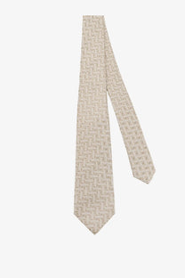 Beige Kiton men’s silk tie with a subtle lighter geometric pattern crafted from smooth silk for formal wear