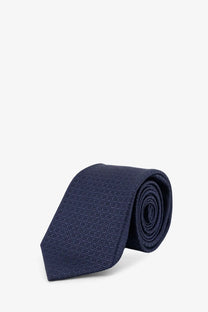 A navy blue silk tie with a subtle geometric pattern from kiton men’s silk tie multicolor collection