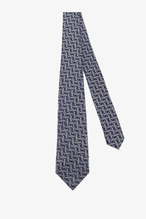Kiton men’s silk tie in navy blue featuring a subtle white geometric pattern made of luxurious silk