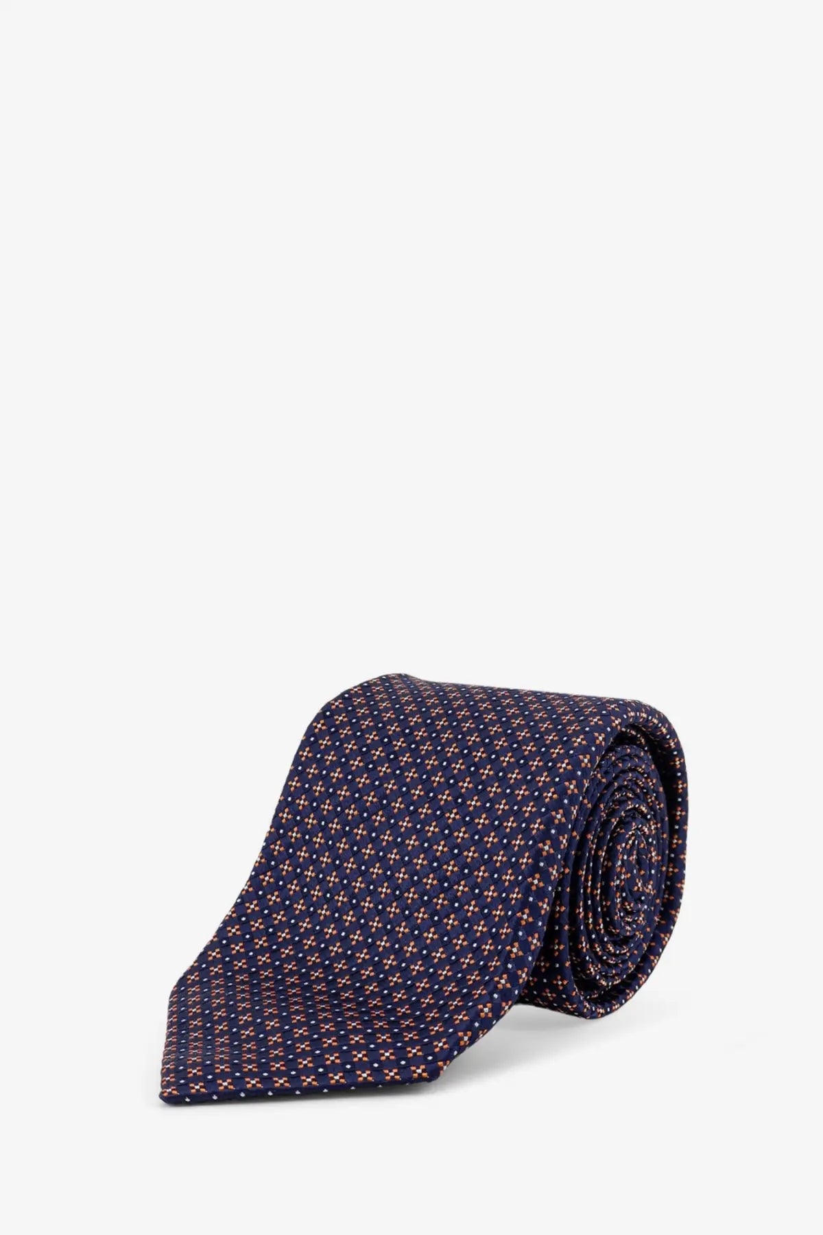 Kiton men’s silk tie in navy blue with a subtle muted pink and white geometric pattern