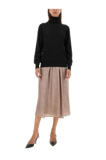 A black fitted turtleneck sweater with long sleeves paired with a kiton women’s midi skirt in blue
