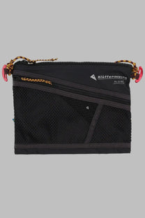 Black mesh and nylon Klättermusen women’s Borsa Algir medium organizer bag with pink zipper pulls and gold-tone hardware