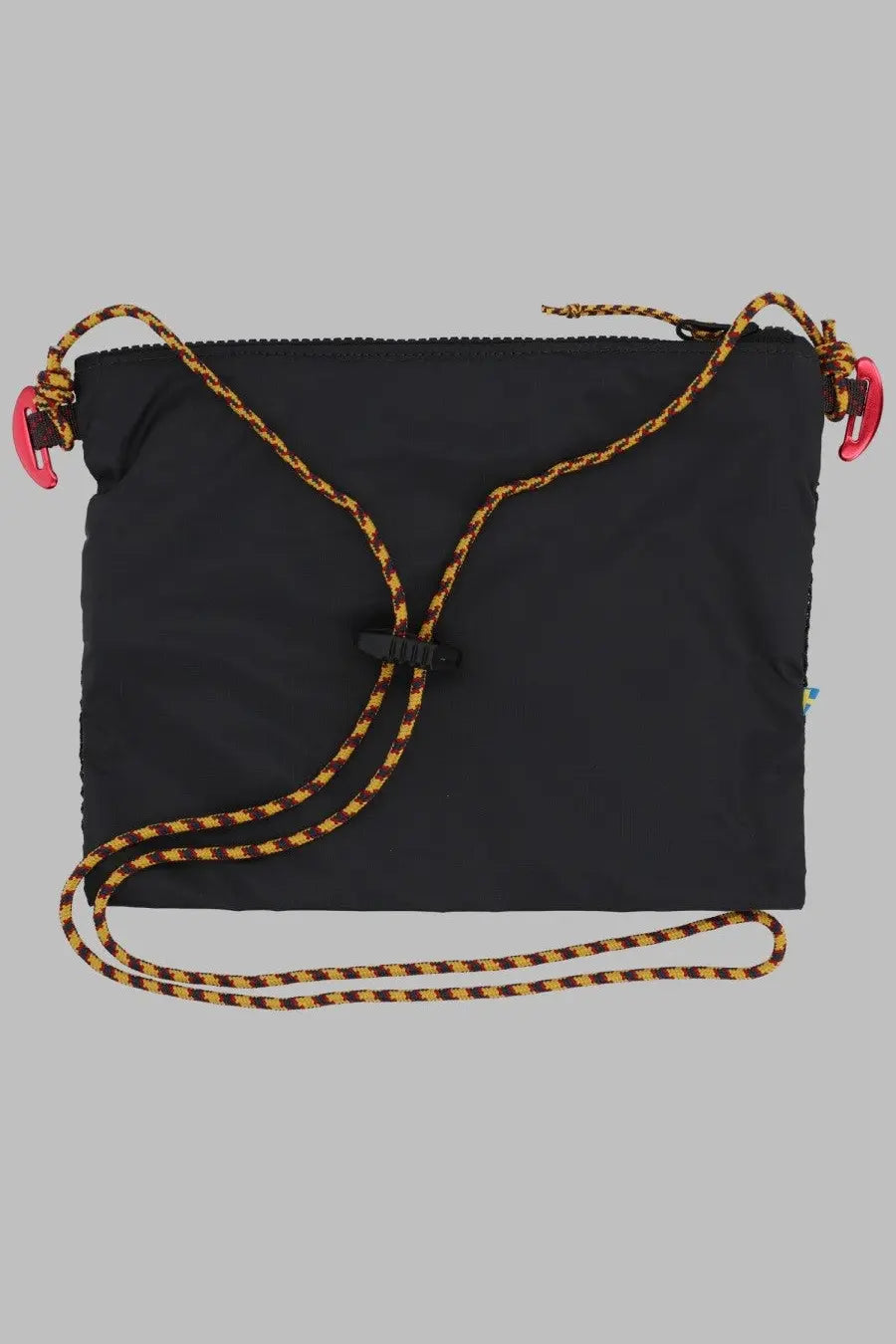 Black nylon klättermusen women’s borsa algir medium crossbody bag with yellow black braided strap and pink clips