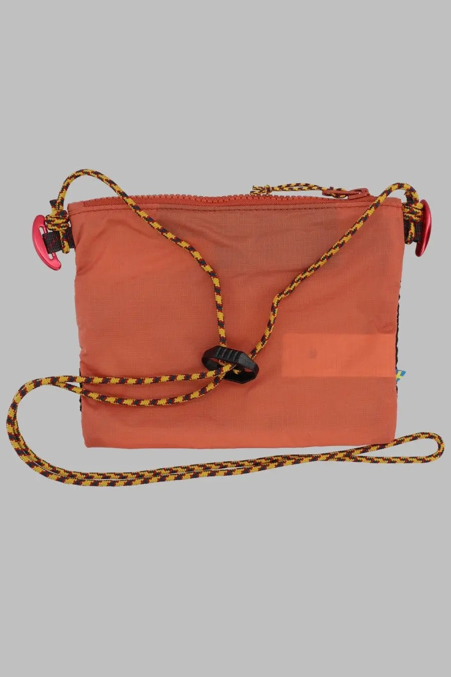 KläTtermusen women’s borsa algir medium orange nylon crossbody bag with yellow and black braided strap and pink clips