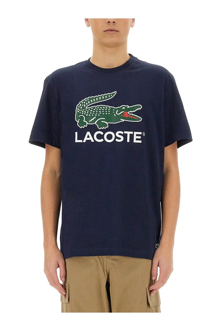 Navy blue Lacoste men’s cotton t-shirt with green crocodile logo and white Lacoste lettering on front