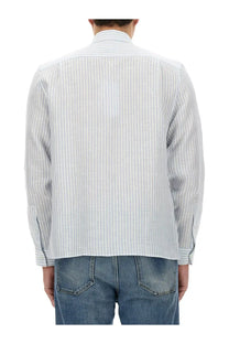 Lacoste men’s light blue and white striped long-sleeved button-up shirt with classic collar and cotton fabric
