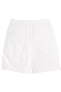 Lacoste men’s white cotton shorts with elastic waistband and single back pocket shown from the back side