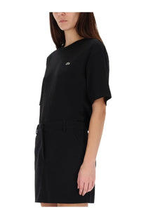 Lacoste women’s black short-sleeved dress with subtle embroidered logo and side pockets made from soft fabric