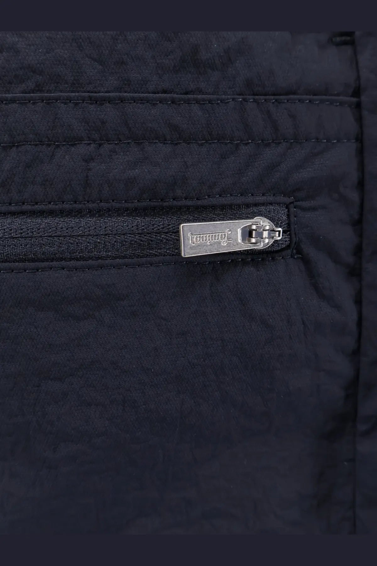 Black quilted nylon jacket with silver dolce and gabbana zipper pull paired with laminar mens blue nylon bermuda shorts