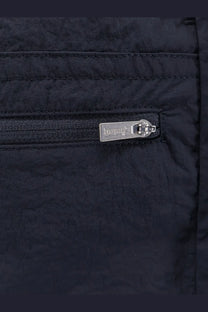 Black quilted nylon jacket with silver dolce and gabbana zipper pull paired with laminar mens blue nylon bermuda shorts