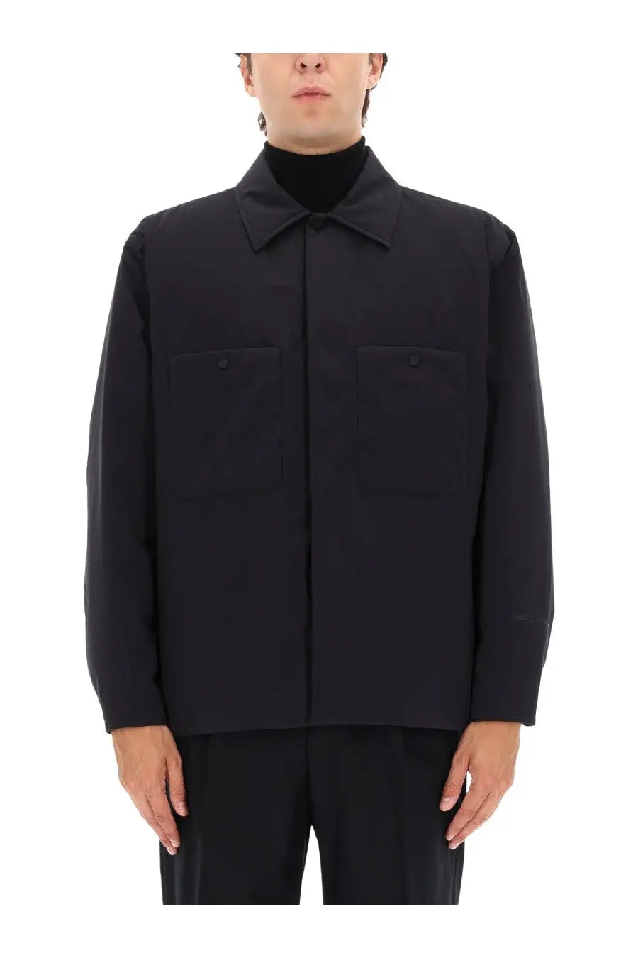 Laminar men’s two layer Goretex shirt jacket black with long sleeves collar and two front pockets visible from front