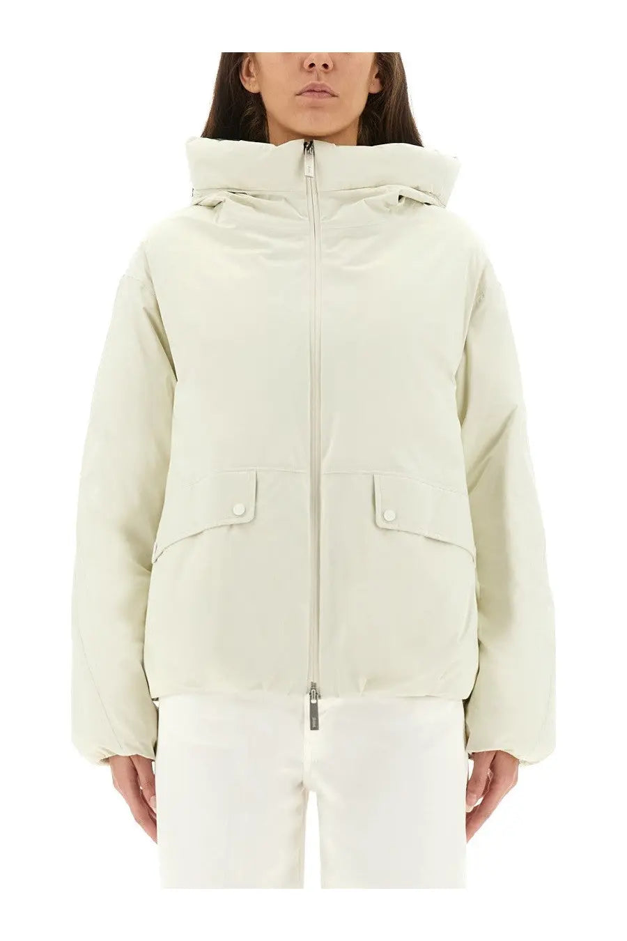 Laminar women’s cream-colored Goretex puffer jacket with hood front zipper and two flap pockets with white buttons