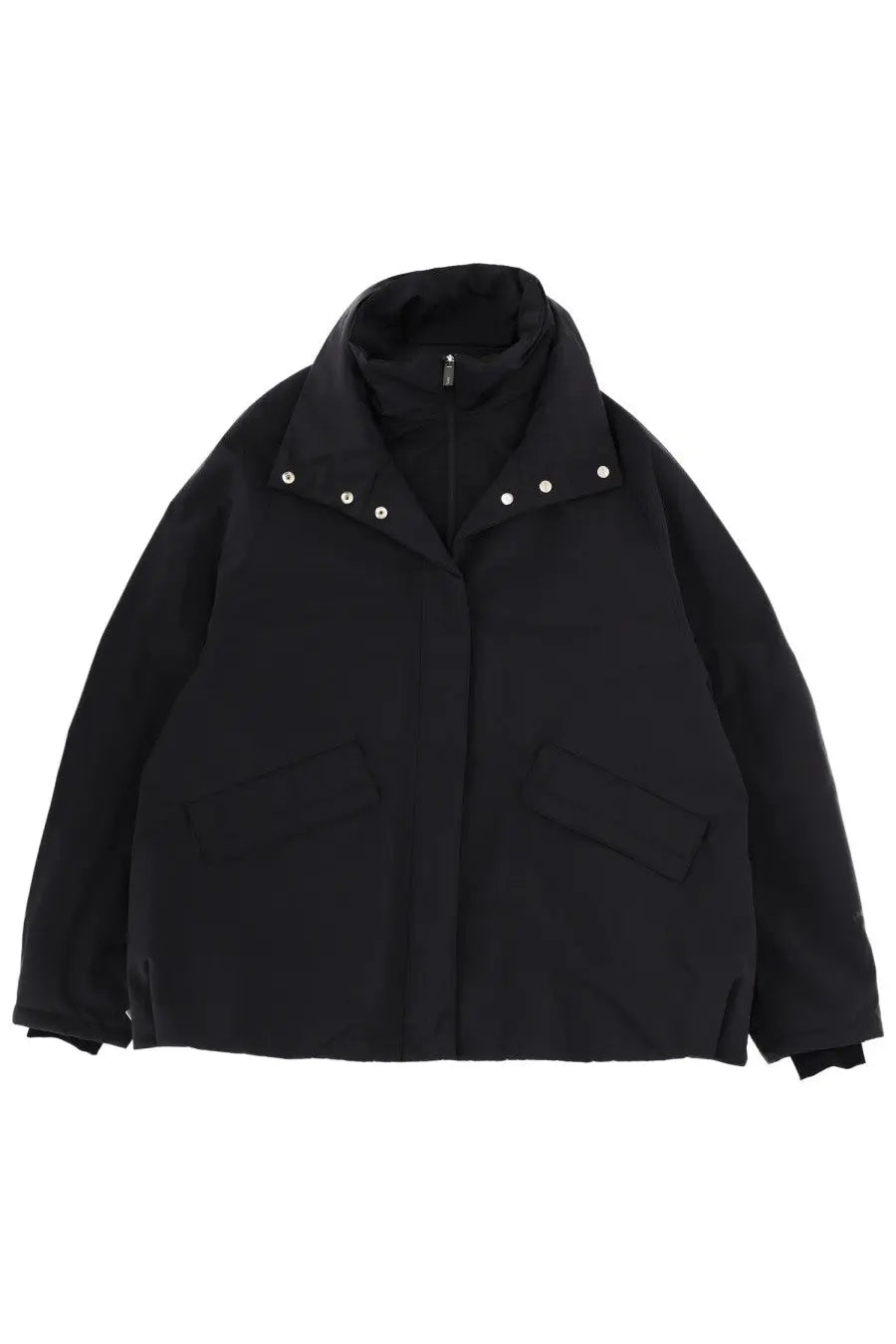 Laminar women’s black puffer jacket with high collar and silver-toned snap buttons for cold weather comfort