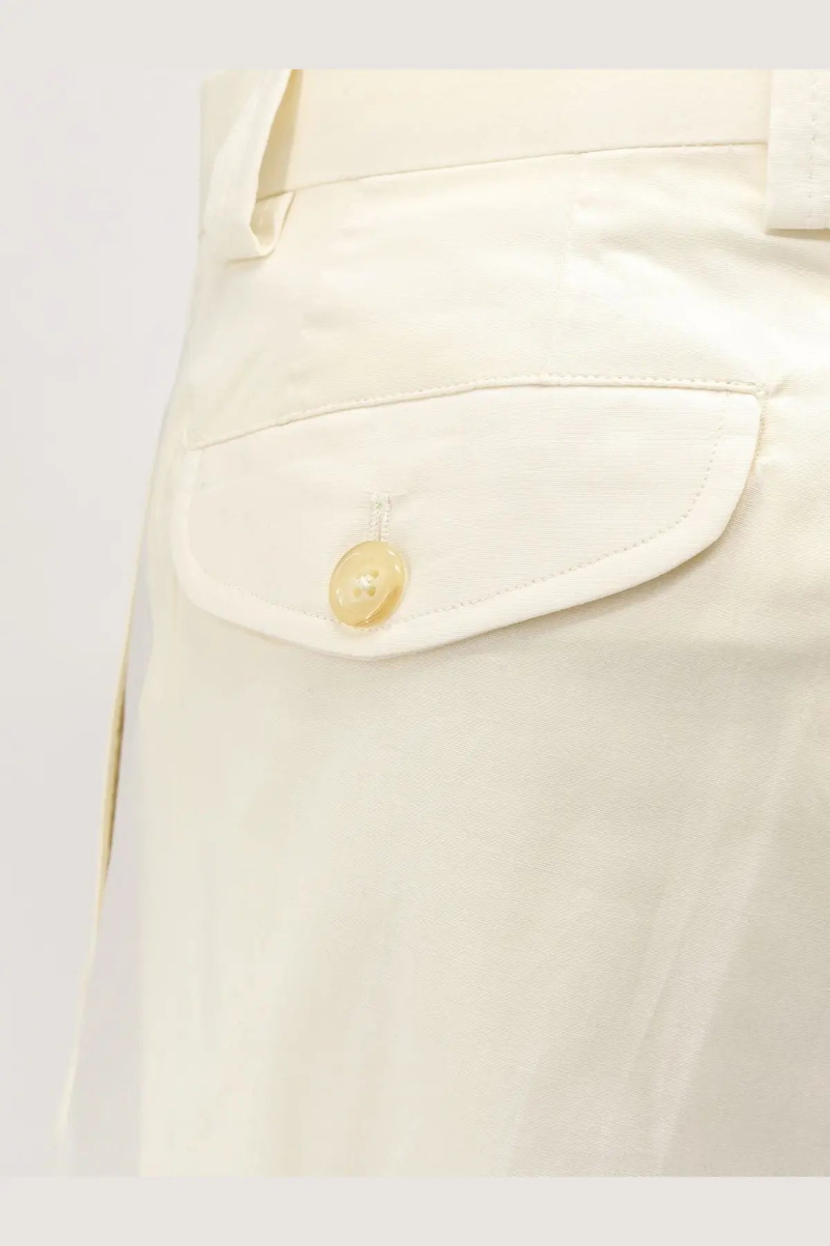 Cream-colored button detail on white fabric pocket of laneus men’s stretch cotton trousers white
