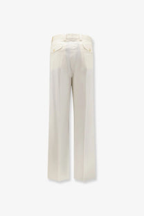 Cream-colored wide-leg laneus men’s stretch cotton trousers with tailored fit and buttoned back pockets shown from the back