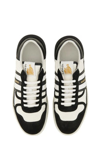 Lanvin men’s sneaker clay white in black and white with bold stripes suede accents and gold branding details
