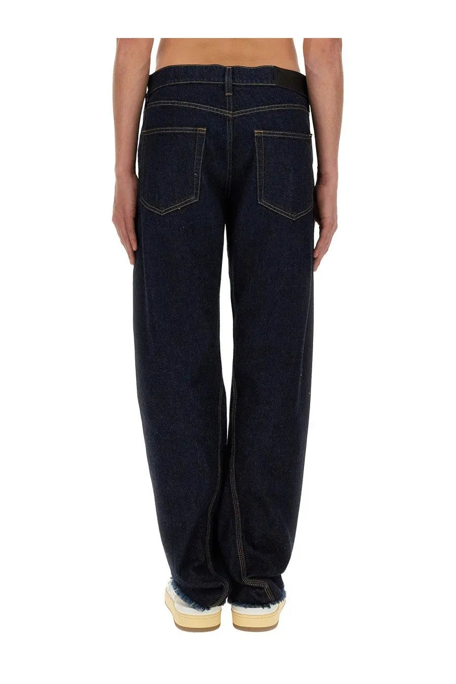 Lanvin men’s twisted jeans in dark indigo denim with contrasting light stitching and a straight-leg cut