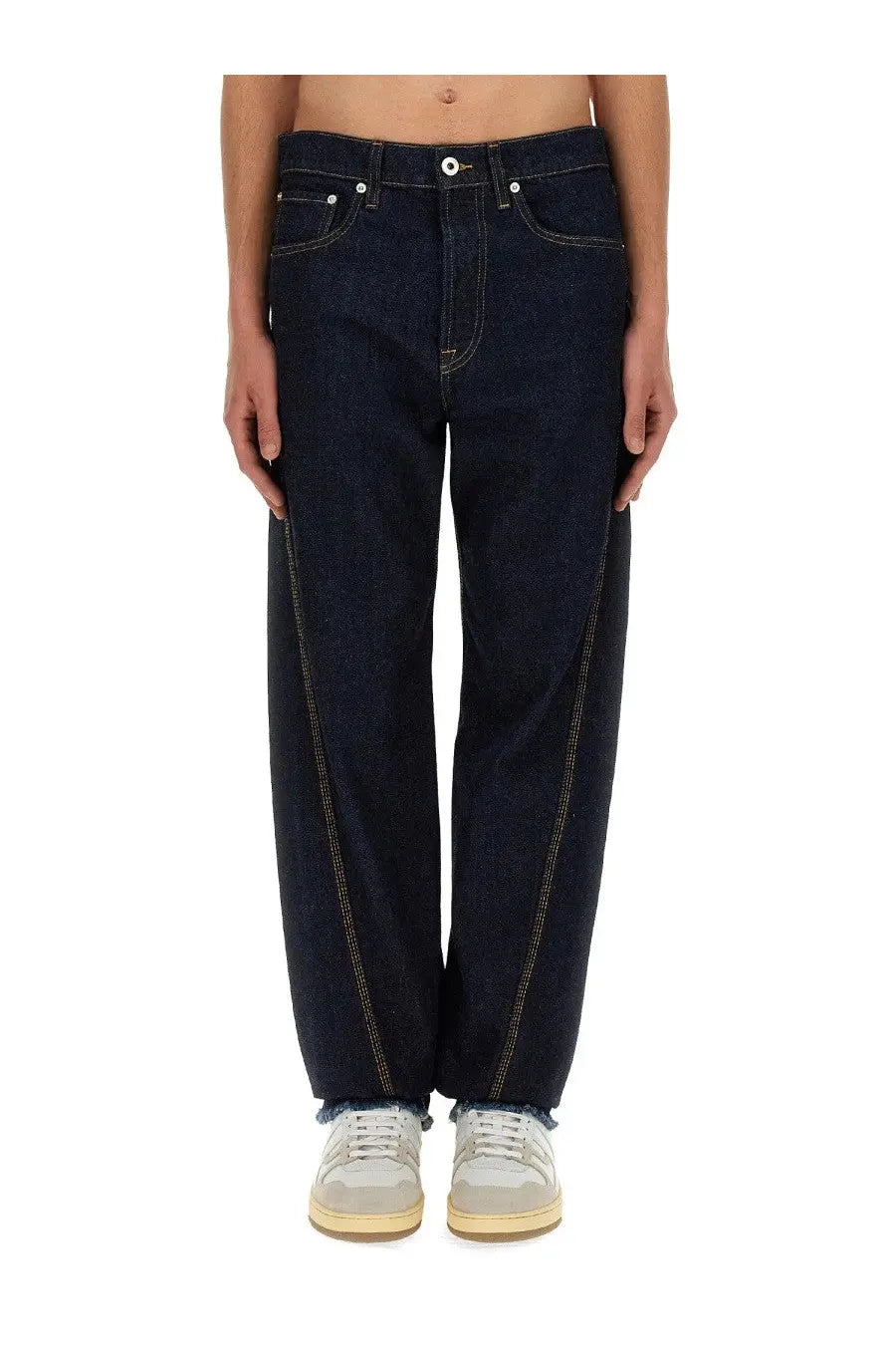 Lanvin men’s twisted jeans in dark indigo denim with contrasting light stitching and frayed hem front view