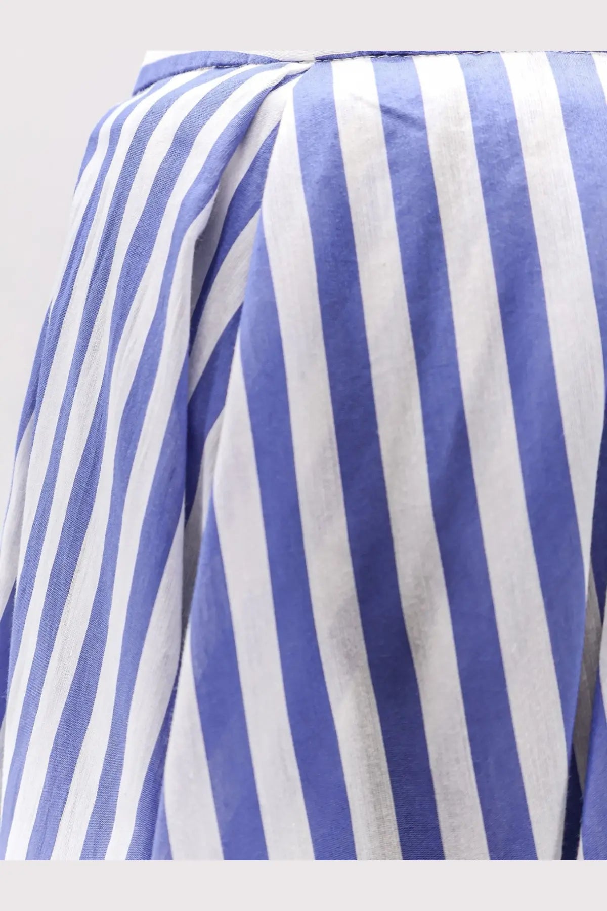 Blue and white vertically striped cotton blouse with relaxed slightly wrinkled texture for casual wear