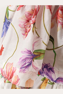 Lavi women’s picciré flounced long skirt beige with a white floral pattern of pink purple and blue blossoms on green stems