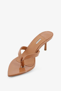 Le silla women’s gisele patent leather sandals in tan with a pointed toe and slender heel visible from the back