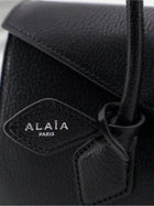 ALAÏA Women's Le Teckel Flap Leather Handbag Black, view 5
