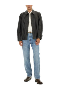 Black leather jacket with classic collar and button front paired with our legacy men’s first cut blue jeans