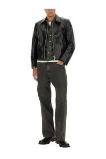 Our Legacy men’s Giacca Mini in Pelle black leather moto jacket with black glossy finish and silver zipper accents