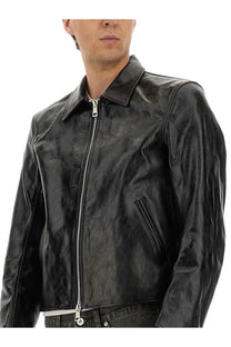 Our Legacy men’s Giacca Mini in Pelle black leather biker jacket with subtle texture and silver zipper accents
