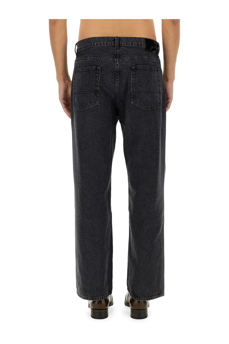 Our Legacy men’s jeans third cut grey dark-wash denim with straight-leg cut and classic back pockets shown from the back