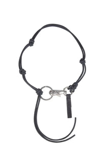Our Legacy men’s Ladon necklace black featuring a black leather keychain with silver-toned metal clasp and tag