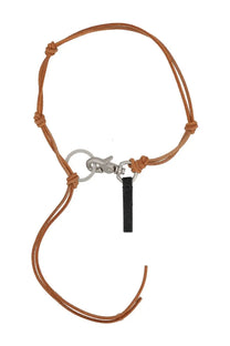 Tan leather cord keychain with silver metal clasp and black tag inspired by Our Legacy men’s Ladon necklace pink style