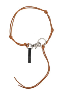 Tan leather cord keychain with silver metal clasp and black tag inspired by our legacy men’s ladon necklace pink