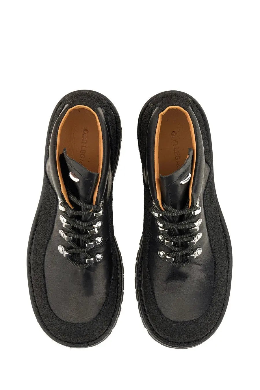 Our legacy men’s leather quest shoe black black leather lace-up boots with silver eyelets and tan interior lining