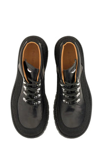 Our legacy men’s leather quest shoe black black leather lace-up boots with silver eyelets and tan interior lining