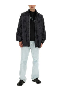 Our Legacy men’s black nylon puffer jacket with glossy quilted texture and front zipper closure