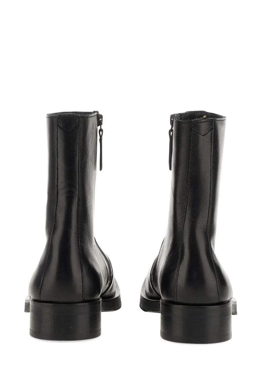 Our Legacy men’s Stivale Camion black leather ankle boots with matte finish and visible stitching along the sides