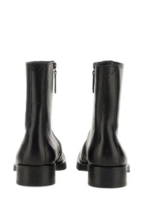 Our Legacy men’s Stivale Camion black leather ankle boots with matte finish and visible stitching along the sides