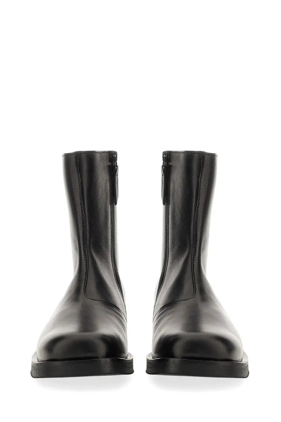 Our legacy men’s stivale camion black leather ankle boots with sleek minimalist design and inner side zippers