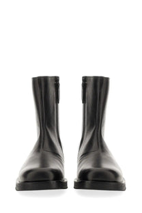 Our legacy men’s stivale camion black leather ankle boots with sleek minimalist design and inner side zippers