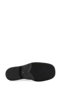 Black rubber sole with textured grip and small oval logo near heel on our legacy men’s stivale camion black boot