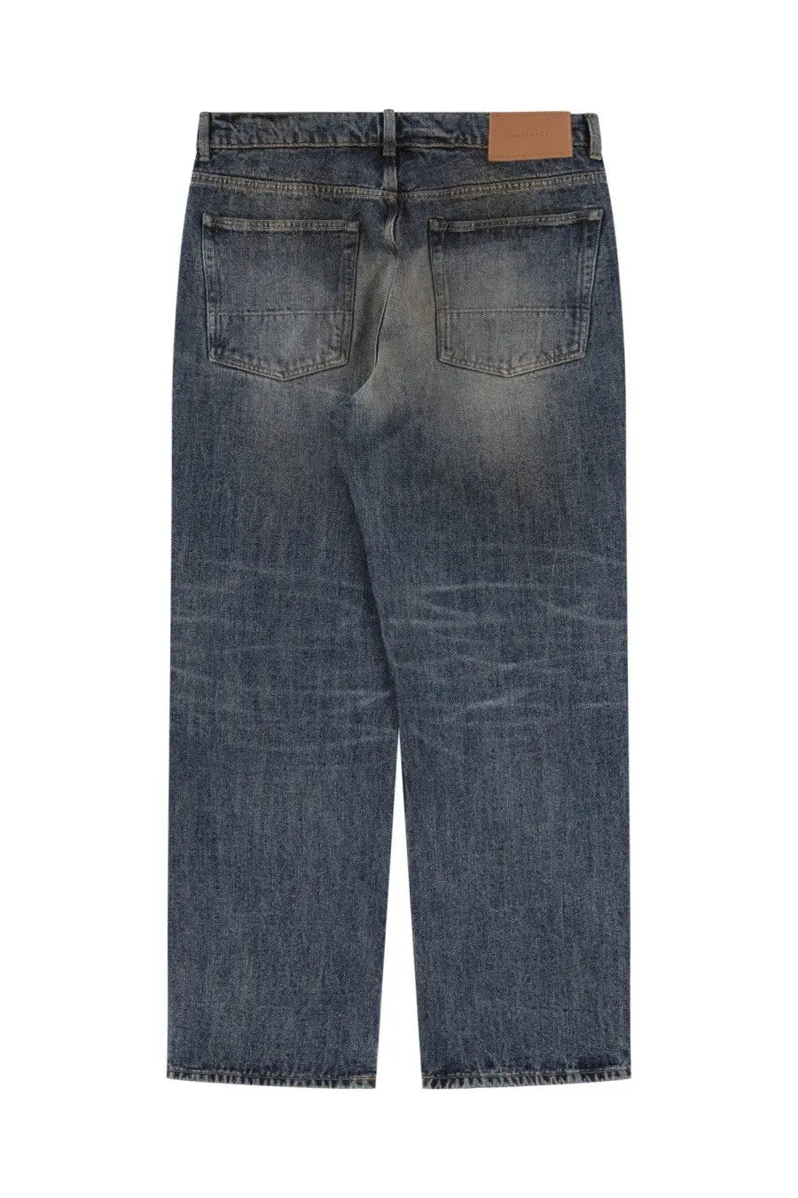 Our Legacy men’s third cut jeans in blue dark-wash denim with a faded distressed look and brown leather patch back view