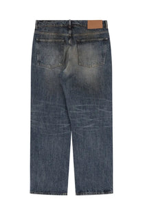 Our Legacy men’s third cut jeans in blue dark-wash denim with a faded distressed look and brown leather patch back view