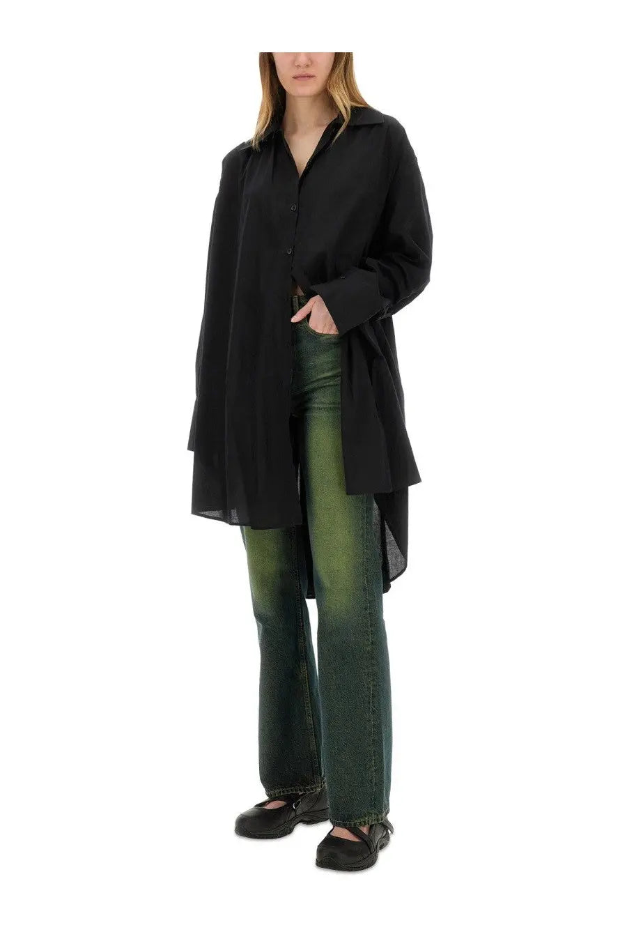 Black oversized button-up shirt with relaxed asymmetrical hemline paired with our legacy women’s boot cut malibu jeans green