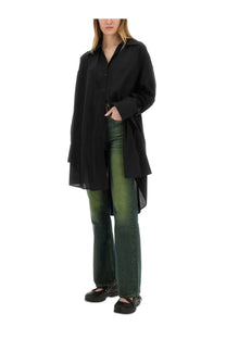 Black oversized button-up shirt with relaxed asymmetrical hemline paired with our legacy women’s boot cut malibu jeans green