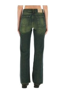 Our Legacy women’s boot cut Malibu jeans green shown from the back in dark green faded denim with classic pockets