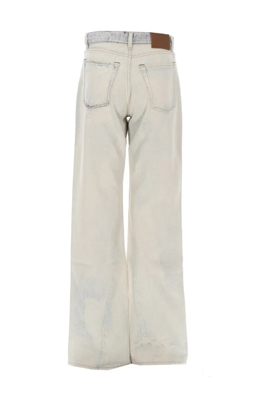 Wide-leg light faded wash denim jeans with subtle distressing and brown leather patch on waistband from our legacy women