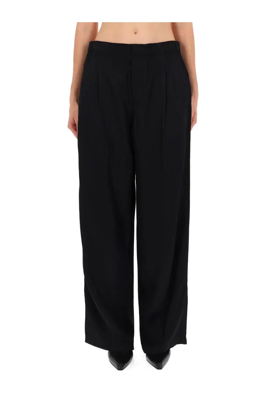 Our Legacy women’s black wide-leg trousers with sleek tailored fit and subtle pleats at the waistband