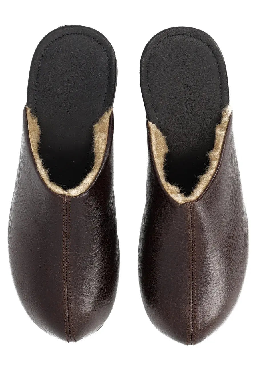 Brown leather clog-style slippers with light shearling lining and our legacy branding on the insole